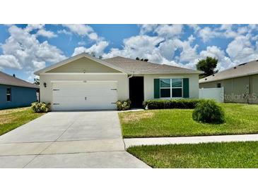 Charming single-story home with a well-manicured lawn and attached two-car garage in a desirable neighborhood at 1216 August Sky Dr, Deltona, FL 32738