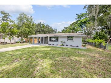 Charming single-story home with a well-maintained lawn and covered front porch for relaxing in the beautiful weather at 173 Cedar Ave, Orange City, FL 32763