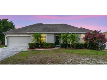 Charming single-story home featuring manicured landscaping and a welcoming front entrance at 2234 N Normandy Blvd, Deltona, FL 32725