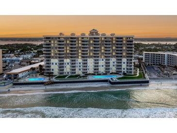 Stunning beachfront condo building with balconies and ocean views, offering luxurious coastal living at its finest at 2403 S Atlantic Ave # 410, Daytona Beach, FL 32118