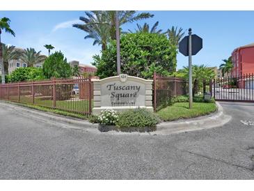 Welcoming entrance to Tuscany Square Condominiums with a well-maintained sign and landscaping at 424 Luna Bella Ln # 330, New Smyrna Beach, FL 32168
