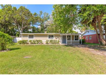 Charming single-story home with well-maintained lawn and lush landscaping for a welcoming curb appeal at 442 Dorothy Ave, Daytona Beach, FL 32117