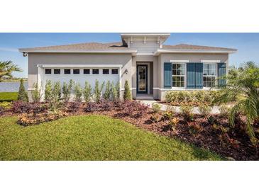 Beautiful one-story home with landscaping and two-car garage at 2175 Aibonito Cir, Clermont, FL 34711