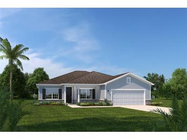 Single-story home with gray siding, brown roof, and a two-car garage at 746 Copper Creek Dr, New Smyrna Beach, FL 32168