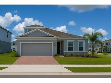 Charming single-Gathering home features a two-car garage, landscaped yard and a well-manicured lawn at 500 Crossings Ave, St Cloud, FL 34771
