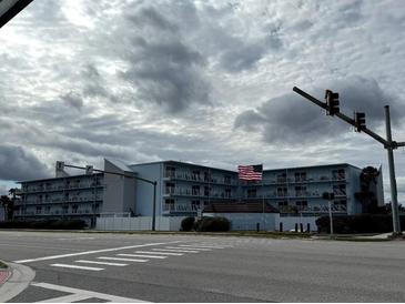 Building exterior, showcasing its location and curb appeal at 3700 S Atlantic Ave # 405, New Smyrna Beach, FL 32169