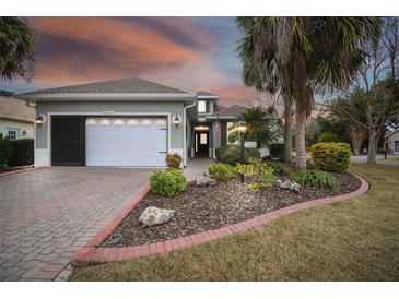 Attractive single-story home with landscaped yard and two-car garage at 8320 Sw 82Nd Loop, Ocala, FL 34481