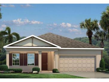 Charming single-Gathering home features a two-car garage, and well-manicured landscaping at 424 Hammock Oaks Blvd, Lady Lake, FL 32159