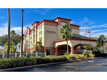The Galleria Inn is a peach and red three-story building with palm trees at 3000 Maingate Ln # 420, Kissimmee, FL 34747