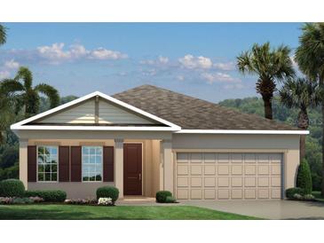 Charming single-story home featuring a neutral color palette, complemented by neat landscaping and a two-car garage at 1314 Whispering Ln, Minneola, FL 34715