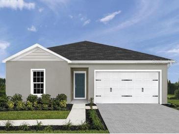 Charming single-story home featuring a two-car garage and well-manicured lawn at 1561 Texas Ave, Sumterville, FL 33585
