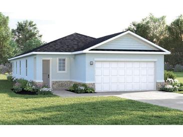 Charming single-story home with a two-car garage, nicely landscaped front yard and stone accents at 5056 Bear Lake Loop, Deland, FL 32724