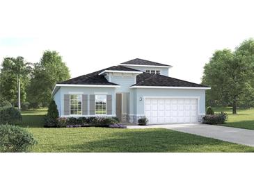 Charming single-Gathering home featuring a two-car garage, well-manicured lawn, and beautiful landscaping at 2088 Aibonito Cir, Clermont, FL 34711
