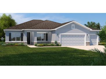 Charming single-story home featuring a three-car garage, stone accents, and a well-manicured lawn at 11018 Nellie Crossing Cir, Clermont, FL 34711