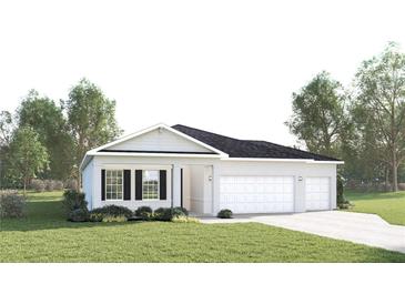 Charming single-Gathering home featuring a well-manicured lawn, attached two-car garage, and stylish white stucco exterior at 11030 Nellie Crossing Cir, Clermont, FL 34711