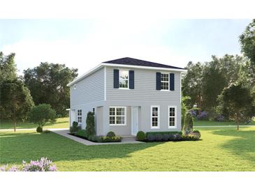 Charming two-story home with gray siding, dark shutters, and a well-manicured lawn at 3737 Isle Royal Pl, Apopka, FL 32712