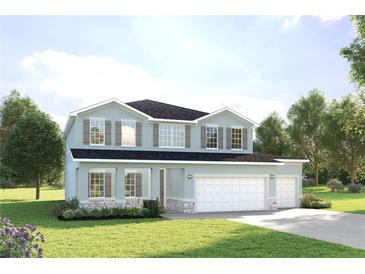 Two-story home features light-blue siding, gray shutters, three-car garage, and manicured landscaping at 11057 Nellie Crossing Cir, Clermont, FL 34711