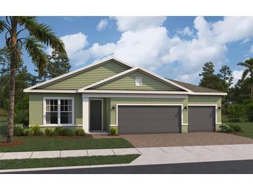 Charming one-story home featuring a two-car garage, lush lawn, and verdant landscaping at 764 Mystic Gardens Dr, Apopka, FL 32703