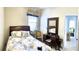 Comfortable bedroom featuring a dark wood mirror and a quaint furniture, providing a serene space at 255 Royal Palm Dr, Davenport, FL 33837