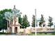 Ridgewood Lakes community entrance featuring landscaped grounds and elegant architecture at 255 Royal Palm Dr, Davenport, FL 33837