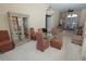 Open-concept dining area featuring a chandelier, glass table, and a view of the living spaces at 255 Royal Palm Dr, Davenport, FL 33837