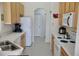 Functional kitchen with white appliances and ample cabinet space, ready for everyday cooking and meal prep at 255 Royal Palm Dr, Davenport, FL 33837