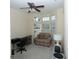Bright living room with natural light from bay windows, ideal for home office or creative space at 255 Royal Palm Dr, Davenport, FL 33837