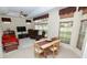 Comfortable living room area adjacent to dining, features large windows and a ceiling fan at 255 Royal Palm Dr, Davenport, FL 33837