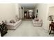 Spacious living room with neutral carpet, offering an open layout to the dining area, perfect for entertaining at 255 Royal Palm Dr, Davenport, FL 33837