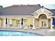 Resort-style pool with lush landscaping, a tranquil fountain, and ample lounge seating, creating a relaxing oasis for residents at 255 Royal Palm Dr, Davenport, FL 33837
