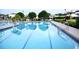 Inviting community pool with clear blue water, perfect for relaxation and recreation in a serene, well-maintained environment at 255 Royal Palm Dr, Davenport, FL 33837