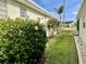 Landscaped yard featuring lush greenery and well-maintained lawn space at 255 Royal Palm Dr, Davenport, FL 33837