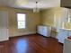 Dining room with hardwood flooring and ample natural light at 1116 W Line St, Leesburg, FL 34748