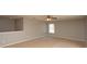 Neutral bonus room with carpet and natural light provided by window with shade at 33953 Terragona Dr, Sorrento, FL 32776