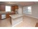 Well-lit kitchen featuring an island with granite countertops, stainless steel appliances, and a wooden plank ceiling at 33953 Terragona Dr, Sorrento, FL 32776