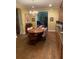 A lovely dining room with wood floors, a chandelier and wood cabinets at 850 Eden Dr, Saint Cloud, FL 34771