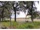 Lake view with trees in foreground at 850 Eden Dr, Saint Cloud, FL 34771