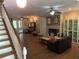 Cozy living room with wood floors, fireplace, staircase and plenty of space at 850 Eden Dr, Saint Cloud, FL 34771