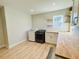 Bright laundry room with floating shelves, butcher block countertop, and new washer and dryer at 9123 Silver Lake Dr, Leesburg, FL 34788