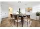 Elegant dining room featuring a six-seat table and modern art at 227 W 7Th St, Apopka, FL 32703