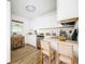 Modern kitchen with white cabinets, stainless steel appliances, and light wood countertops at 227 W 7Th St, Apopka, FL 32703