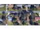 Overhead view of the property and surrounding neighborhood featuring mature trees and suburban homes at 3240 Flamingo Ln, Mulberry, FL 33860