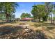 Backyard with a fire pit and seating area, perfect for outdoor gatherings and relaxation at 3240 Flamingo Ln, Mulberry, FL 33860