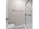 Bathroom featuring a glass shower, toilet, and towel rack at 3240 Flamingo Ln, Mulberry, FL 33860