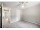 Bedroom with carpet flooring, a ceiling fan, and a closet at 3240 Flamingo Ln, Mulberry, FL 33860