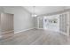 Bright dining room with modern floors and glass paneled doors to bring in lots of light at 3240 Flamingo Ln, Mulberry, FL 33860