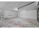 Unfinished garage space, ready to be customized to your specific needs and storage solutions at 3240 Flamingo Ln, Mulberry, FL 33860