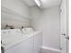 Laundry room featuring modern washer and dryer with wire rack storage shelf above at 3240 Flamingo Ln, Mulberry, FL 33860