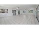 Spacious living room with tile flooring, windows, and ceiling fans at 3240 Flamingo Ln, Mulberry, FL 33860