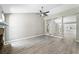 Bright living room featuring new floors, tall ceilings, stone fireplace, and seamless transition to the dining area at 3240 Flamingo Ln, Mulberry, FL 33860